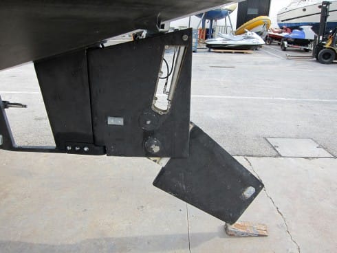 The rudder on our OVNI 435, partially lowered. Here, the side plates have been removed to show the internal hydraulic ram used for raising the lower section. The prop is well protected by a full skeg.