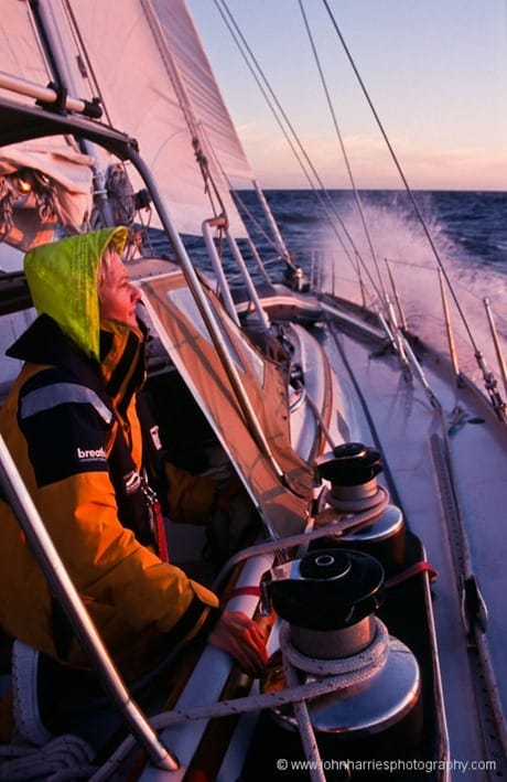 Phyllis Nickel looks out into the sunset during a windward sail in The The Gulf of St Laurence, off the west coast of Newfoundland on `Morgan`s Cloud`.