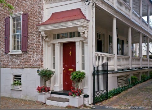 This is another shot where I pared the busy scene that included parked cars and power lines down to its bare essentials to tell the story of Charleston houses that are turned sideways with a single room on the street end and a piazza on the side. To me, a lot of the reason the shot works is the strong diagonals, which are almost always more interesting than horizontal and vertical lines in a photograph. I moved back and forth until I got the balance of the window, door and piazza just as I wanted it.