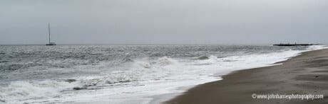 Sailboat underway close to Cape May shore