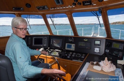 Phyllis checks out the wheelhouse of a Nordhavn 50, the model we liked the best of the several we have looked at for this article.