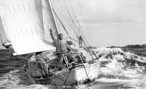 April 1969: Robin Knox-Johnston waving aboard his 32ft yacht SUHAILI off Falmouth, England after becoming the first person to sail solo non-stop around the globe.