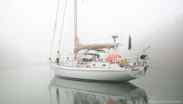 Phyllis gets "Morgan's Cloud" ready to get underway. There's a bit of visibility in the snug cove, but outside it will be pea-soup.